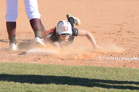 Lady Bulldog Whitney Christian slides back onto first base during a game against Hiwassee College at Fesmire Field. Union won 11-0.  - Photo by Anne Richoux