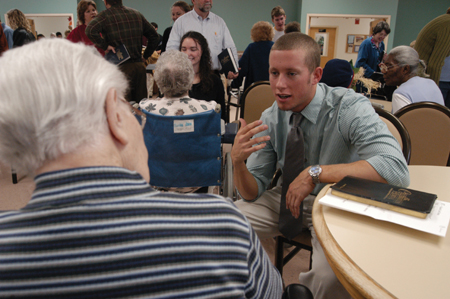 Senior Jeremy Warner spent time during the Day of Remembrance to visit with a resident at Bells Nursing Home. - Photo by Jonathan Blair