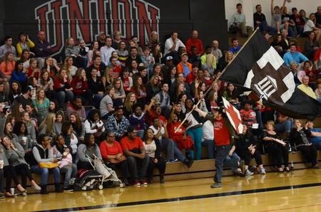 Ryan Harris, sophomore engineering major, gets the crowd excited during a timeout of the homecoming game against Delta State. - Photo by Anne Richoux