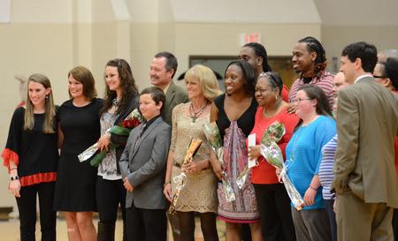 The senior Lady Bulldogs pose with their families and coaches after their homecoming game in the Fred DeLay Gymnasium.  - Photo by Anne Richoux