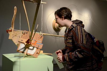 Sierra Owens-Hughes, junior art major, explores the work in Travis Townsend's Recent Sculpture and Drawings exhibit in the Art Gallery. - Photo by MiKalla Cotton