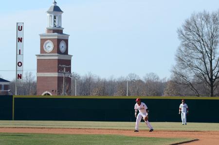 Bulldog Michael Flores prepares at his shortstop position as a Southern Arkansas University player comes up to bat at Fesmire Field.  - Photo by Anne Richoux