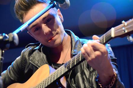 Joey Stamper, member of Nashville-based Christian band Anthem Lights, plays guitar at the annual spring concert sponsored by SAC. - Photo by Amanda Rohde