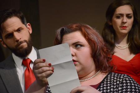 Jay Griffith, senior English and French major, Caitie Vance, junior theatre and speech major, and Allison Hearn, senior theatre major, read a letter from Hamlet to Ophelia while performing in Hamlet. - Photo by Amanda Rohde