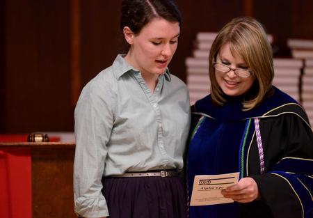 Janie Owen, junior social work major, recites the pledge of Alpha Chi during the induction ceremony for Union's chapter of the honor society.  - Photo by Anne Richoux