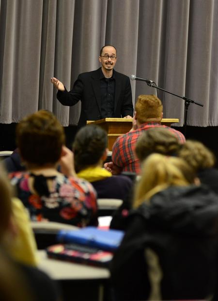 American poet Kevin Brown speaks about the perception of the English major during a presentation in Harvey Auditorium. - Photo by Jacob Moore