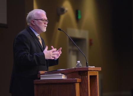 Timothy George, dean of Beeson Divinity School and professor of church history, speaks on "The Road to Barmen" in the Carl Grant Events Center. - Photo by Amanda Rohde