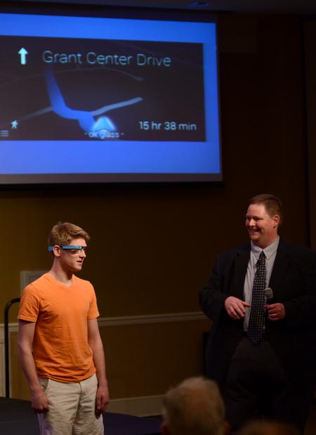 Quinten Brasher, freshman history major, asks Google Glass for directions during a lecture by Kevin Trowbridge, assistant professor of public relations at Belmont University. - Photo by Jacob Moore