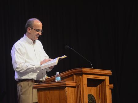 George Guthrie, Benjamin W. Perry Professor of Bible, reads from Isaiah 6:1-8 during his chapel message. - Photo by Amanda Rohde