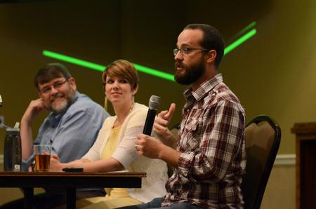 Panelists Todd Stanfield, Cini Bretzlaff-Holstein, and Tom Adams discuss their thoughts after viewing the documentary "A Place at the Table" during the "What's On Your Plate: Food Insecurity in the United States" social work conference in the Carl Grant Events Center. - Photo by Anne Richoux