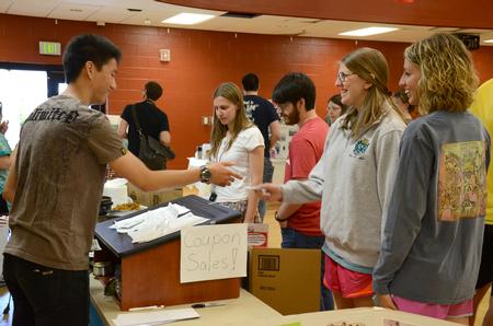Students enter to buy their coupons for the International Food Fair hosted by the International Students Union in the gym of the Bowld Student Commons  - Photo by MiKalla Cotton