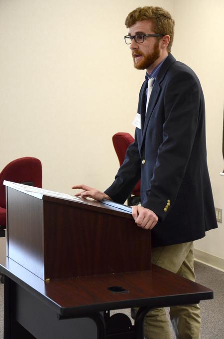 Trey Weise, senior english and philosophy double major, presents his project for the annual Scholarship Symposium. - Photo by MiKalla Cotton