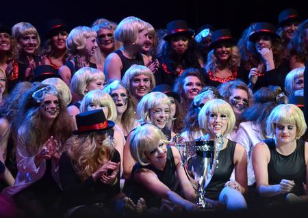 Chi Omega accepts the trophy for the best large group performance at the 17th Annual Variety Show at the Carl Perkins Civic Center. - Photo by MiKalla Cotton