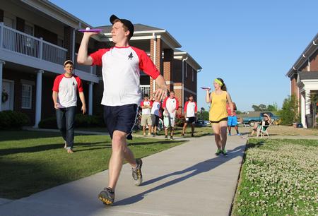 Clark Bilbrey, freshman biology major, leads the balancing race at the Union Field day event presented by Union Res Life at the Bowld Commons. - Photo by Matt McDaniel