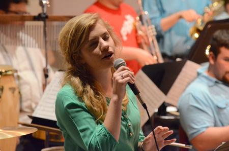 Madelyn Carson, senior music education major, sings in the Jazz Band Concert. - Photo by MiKalla Cotton