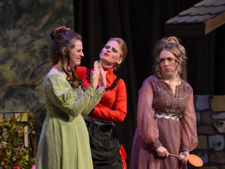 Cassie Robbers, center, junior art major, plays the role of the wicked stepmother alongside Cinderella's stepsisters, played by Heather Porter and Melissa Locke, in the Union University Players' performance of Cinderella. - Photo by Jacob Moore