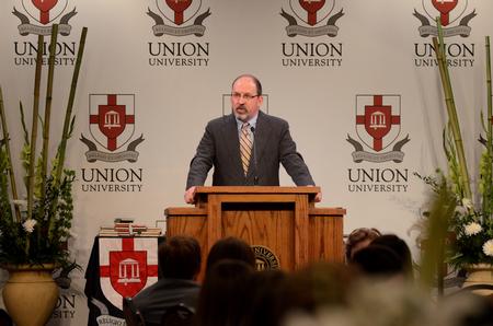 Scott Huelin, director of the honors community, speaks to students during an honors banquet in the Grant Events Center.  - Photo by Anne Richoux