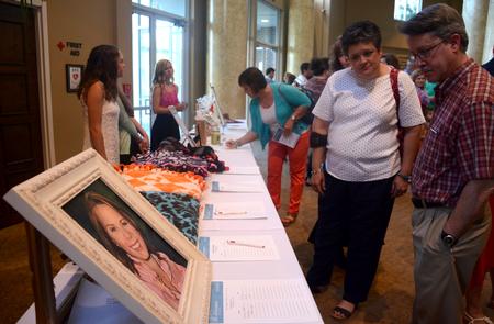 Prior to the benefit concert for the Olivia Greenlee Memorial Scholarship, families and friends participate in a silent auction at West Jackson Baptist Church in support of the scholarship. - Photo by Jacob Moore