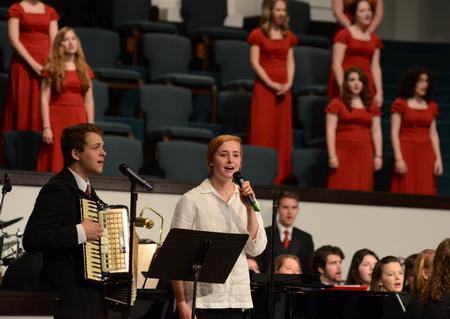 Thomas Griffith, sophomore biology major, and Kelsie Leaf, sophomore public relations major, lead the congregation in singing during the benefit concert for the Olivia Greenlee Memorial Scholarship. - Photo by Jacob Moore