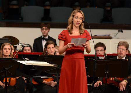 Tori Brooks, senior English major, reads a testimonial about the time she spent with Olivia Greenlee during a benefit concert held to support a scholarship in memory of Greenlee. - Photo by Jacob Moore