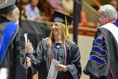 The Tigrett Medal Winner of 2014, Grace Morriss, graduate with a Bachelor of Science in Electrical Engineering, is congratulated on her award during the Spring Commencement Services. - Photo by Emily Stookey