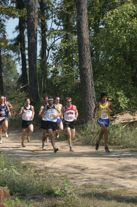 Junior Chris Winter paced himself with fellow competitors during a cross country meet. - Photo by Lindsay Stavish