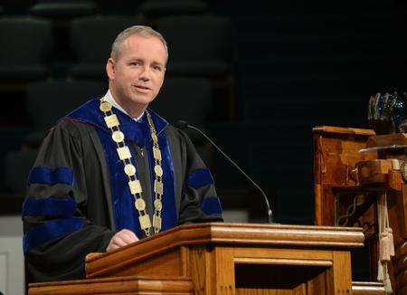 Samuel Dub Oliver greets graduates faculty and friends to the summer commencement at West Jackson Baptist Church. - Photo by Morris Abernathy