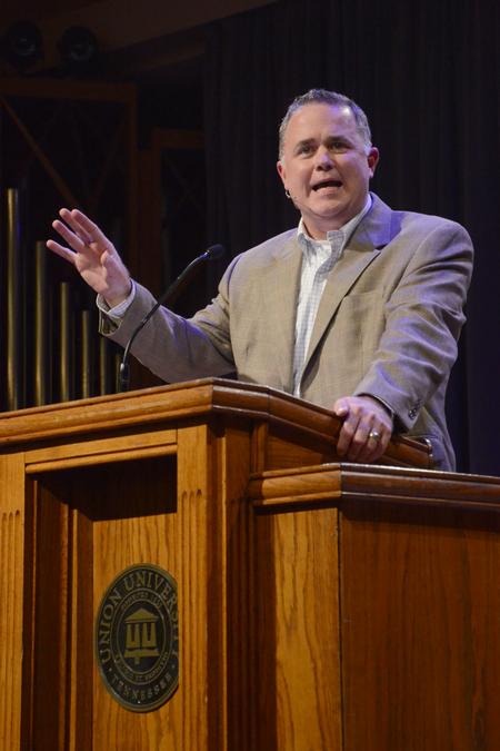 Todd Brady, vice president for university ministries, speaks on the passage Luke 10:25-37 at the new student and parent worship service in the G.M. Savage Memorial Chapel. - Photo by Emily Stookey