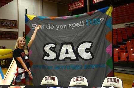 Robin Cunningham, sophomore nursing major and SAC member, is ready to welcome new students to the SAC Focus Fest at Fred DeLay Gymnasium. - Photo by Meg Rushing
