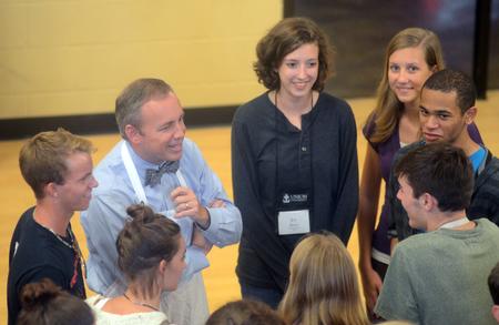 Dr. Dub Oliver, president of the university, talks with new students at the ice cream social in the Bowld Commons. - Photo by Amanda Rohde