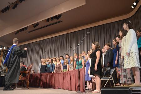 Union University Singers, led by Chris Mathews, associate professor of music and department chair, perform "I'd Rather Have Jesus" at Fall Convocation. - Photo by Emily Stookey