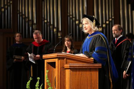 Jeanette Russ, professor of engineering and department chair, reads a passage of scripture at the beginning of Fall Convocation. - Photo by Kristi McMurry Woody