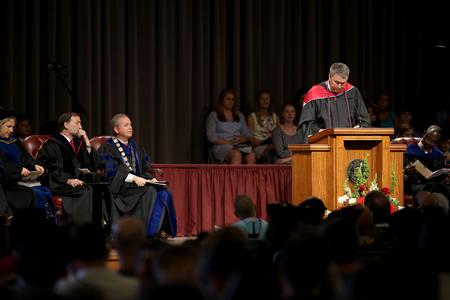 Steven Aldridge, current staff member of the year, reads from Colossians during Fall Convocation. - Photo by Kristi McMurry Woody