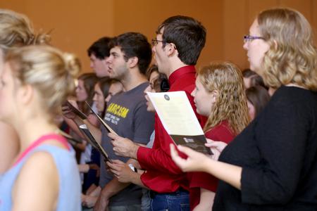 Students, faculty and staff join together and sing "Joyful, Joyful We Adore Thee" at the end of Fall Convocation. - Photo by Kristi McMurry Woody