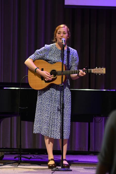 Kelsie Leaf, junior public relations major, leads music in the chapel service. - Photo by Meg Rushing