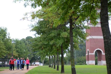 A tour group walks down the sidewalk to Jennings Hall during the first Preview Day of the fall 2014 semester. Over 70 perspective students visited campus with their families.  - Photo by Amanda Rohde