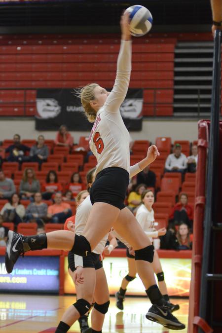 Mallory Baker spikes the volleyball during their game against Mississippi College in the Fred Delay Gymnasium. - Photo by Emily Stookey