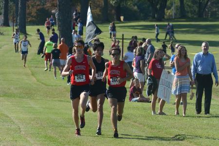 Will Donelson, sophomore chemistry major, and Jake Whitney, sophomore biochemistry major, hold the lead in a cross country meet on campus. - Photo by Meg Rushing