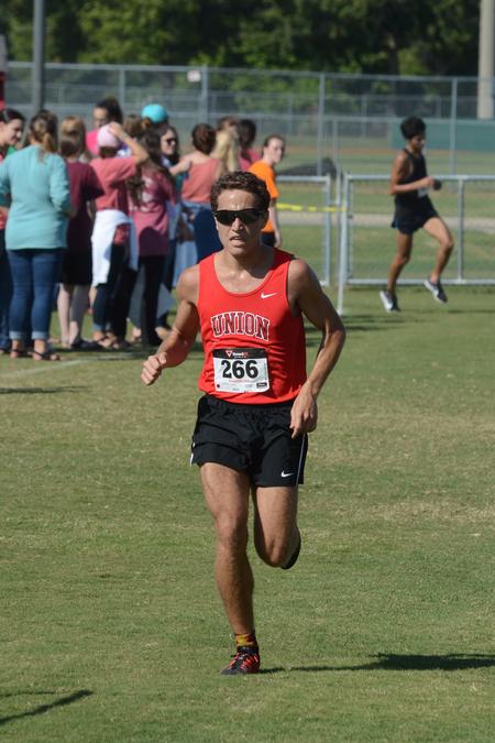 Jake Whitney, sophomore biochemistry major, finishes second in a cross country meet. - Photo by Meg Rushing