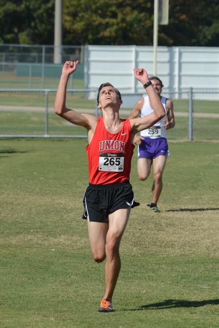 Daniel Regan, freshman accounting major, crosses the finish line in a cross country meet on Union University's campus. - Photo by Meg Rushing