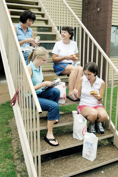 Freshman Emily Watlington, special education major from Whitwell, Tenn. (bottom left) takes a break from moving in to eat lunch with (clockwise) mother Marsha Watlington and family members Martha Morris and Jennifer Blankenship. - Photo by Kristen Hiller