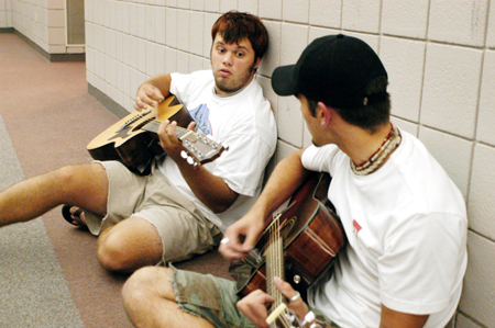 Sophomores Keith Varden and Josh White prepare for Open Mic during FOCUS 2004. - Photo by Kristen Hiller