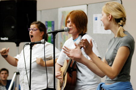Melissa Gruver, Alice Calvery, and Katie Crawford perform at the Open Mic Night during FOCUS 2004. - Photo by Kristen Hiller