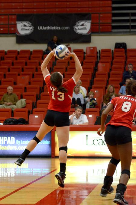 Senior setter, Lydia Wright sets the ball in a match against Williams Baptist College. - Photo by Meg Rushing