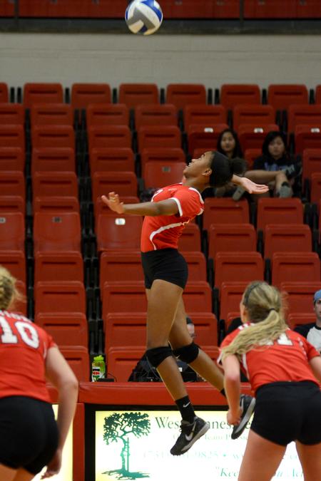 Ceciley Blanchard, freshman outside hitter, approaches for a hit in a match against Williams Baptist College. - Photo by Meg Rushing