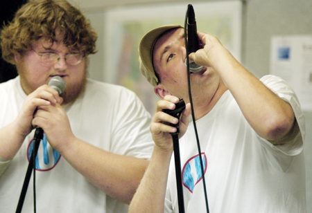 Seniors Jonathan Blair and Wayne Campbell take to the mics at Open Mic during FOCUS 2004. - Photo by Kristen Hiller