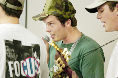 Sophomores Rob Buntain and Brett Jenkins sing during the FOCUS Open Mic Night. - Photo by Kristen Hiller