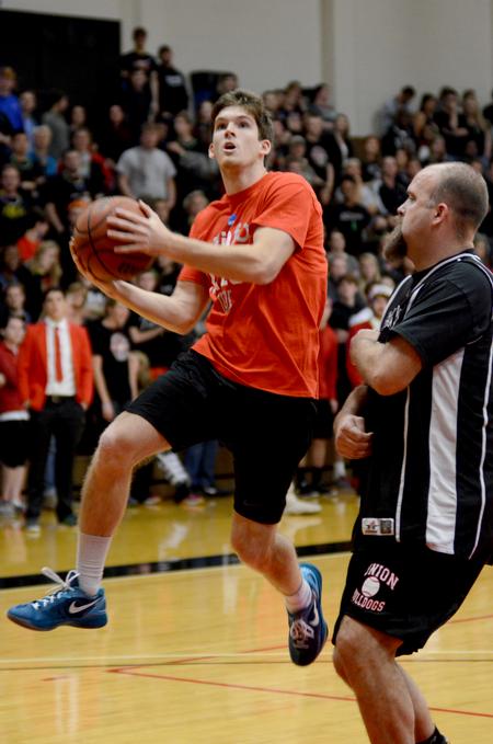 Titus Wade, junior exercise science major, competes in the student/faculty scrimmage at Bulldog Madness. - Photo by Meg Rushing