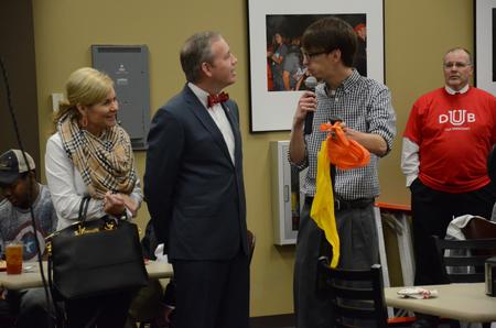 Jared Dauenhauer, assistant director of student leadership and engagement, explains the piñata event to Dub Oliver, president of the university, during a fiesta in Brewer Dining Hall. - Photo by MiKalla Cotton