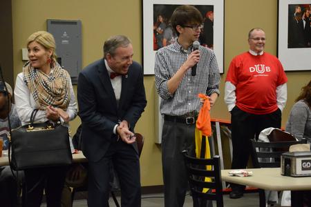 Jared Dauenhauer, assistant director of student leadership and engagement, explains the piñata event to Dub Oliver, president of the university, during a fiesta in honor of the upcoming inauguration in Brewer Dining Hall. - Photo by MiKalla Cotton